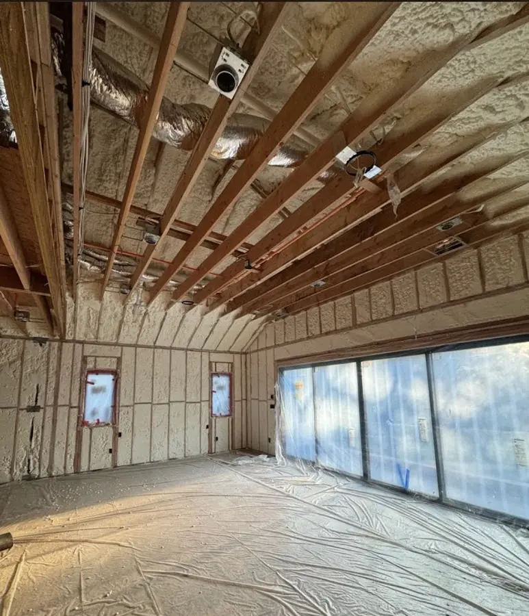 Interior walls and ceiling insulated with spray foam during new construction in Western Springs